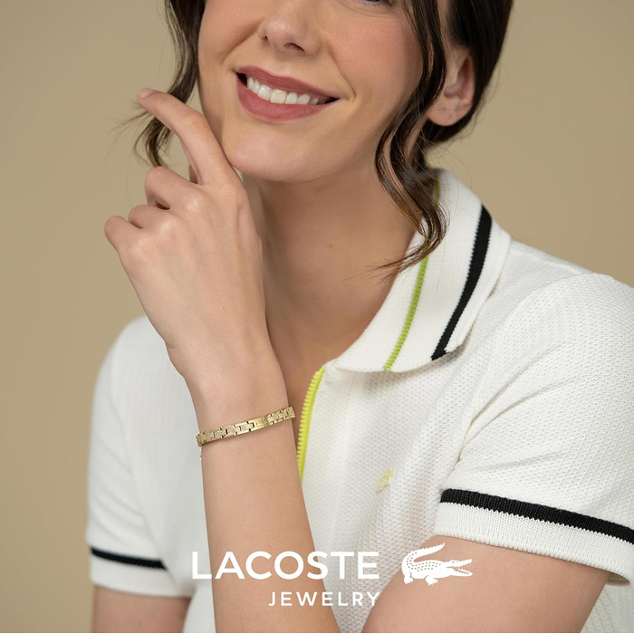 Жіночий браслет Lacoste колекції METROPOLE з застібкою-карабіном та візерунком petit piqué, золотистий
